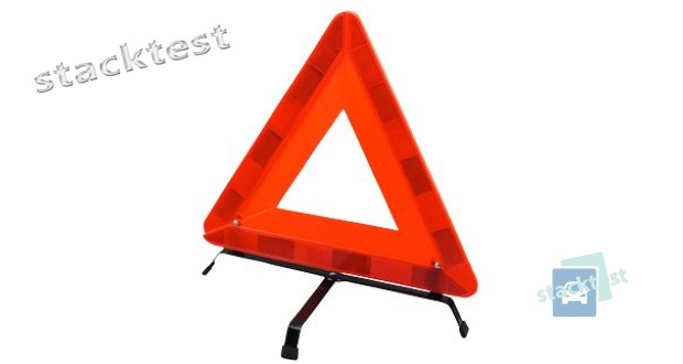 Řidič motorového vozidla, který je povinen užít přenosného výstražného trojúhelníku, jej musí umístit: